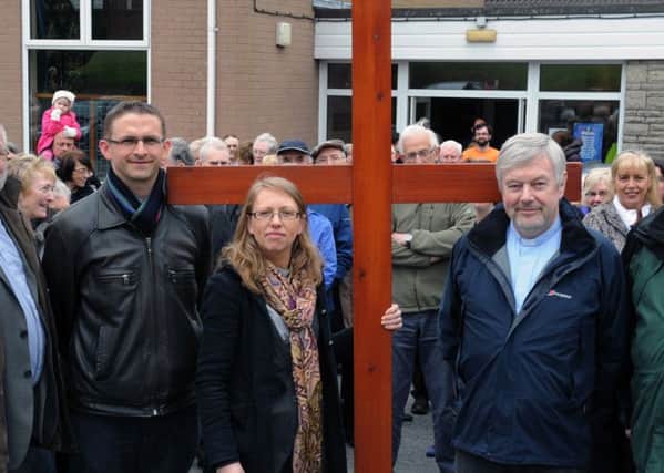 Lambeg clergy pictured prior to the start of the Lambeg Churches Good Friday carrying of the cross walk of witness taken in 2012 at the first of what is now an annual event.  L to R: Rev Stephen McElhinney (Derryvolgie Parish), Rev Helen Freeburn (Assistant Minister of Harmony Hill Presbyterian), Rev Canon Ken McReynolds (Lambeg Parish).