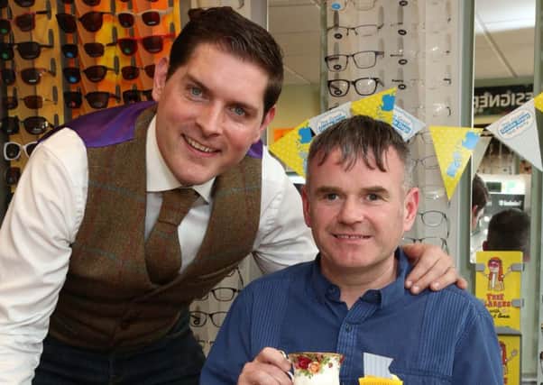 Looking forward to the 'Great Guide Dogs Tea Party' at Specsavers in Larne are singer/songwriter Malachi Cush and Gary Loughran with his guide dog Usher. Pic: Darren Kidd/Press Eye