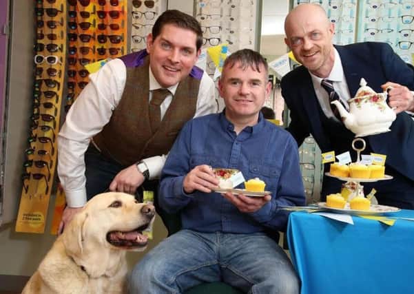 Launching the first Great Guide Dogs Tea Party from left, singer/songwriter Malachi Cush, Gary Loughran with his guide dog Usher and Brian OKane, NI Chair of Specsavers.