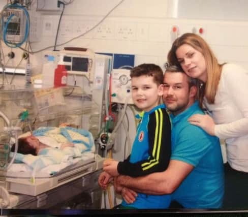 The McIvor family during their time in the Neo Natal Intensive Care Unit in Belfast. Pictured, from left, Franky, older brother Rian with daddy Cormac and mummy Sinead