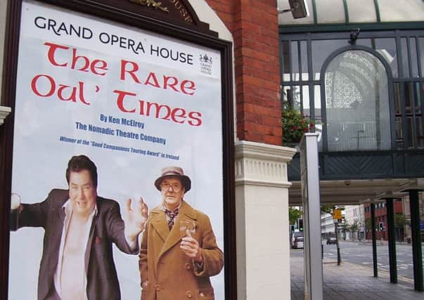 Oliver Moore, left, and Ken McElroy on a billboard at the Grand Opera House in Belfast.