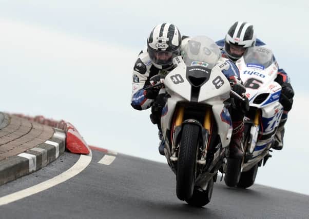 Michael and William Dunlop battle for the lead on the final lap during the opening Superbike race at the North West 200 in 2014.
