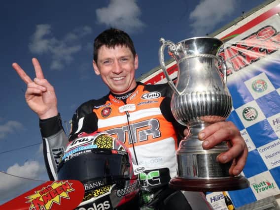 Manx rider Dan Kneen pictured with the Enkalon Trophy at Bishopscourt on Saturday.