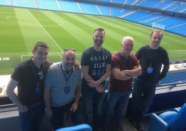 Some members of Lisburn Manchester City Supporters Club on a recent trip to the Etihad stadium.