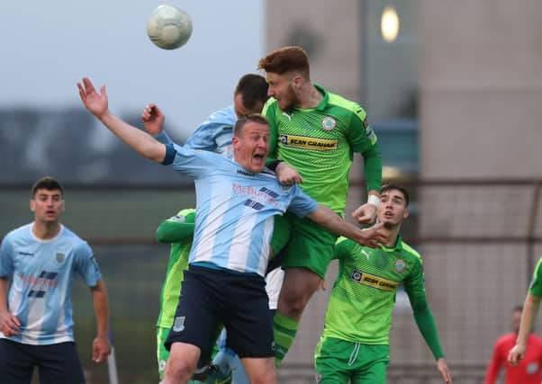 Ballymena United's Kyle Owens in action with Cliftonville's Kym Nelson