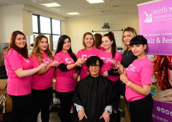 Catherine McCann pictured at North West Regional College Hairdressing Salons where she will have her entire head shaved for charity by hairdressing lecturer Deborah McDaid. Also pictured are students Michelle Duffy, Jessica McColgan, Courtney Clarke, Emma Duffy, Michaela Doherty and Tara Duffy.