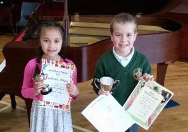 Two young winners in the Junior Piano class at Larne Music Festival.