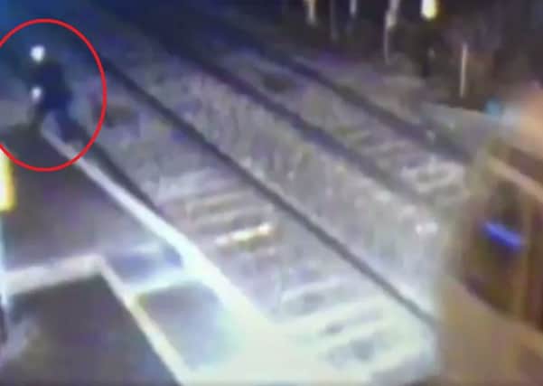 The Belfast bound train comes within metres of hitting the man (circled in red). (Photo: IarnrÃ³d Ã‰ireann)