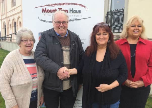 Mount Zion Chairman Thomas McConville welcomes Jennifer Fearon and Noreen Mc Alinden from Craigavon CAB also in photo is Mount Zion director Pearl Snowden.
