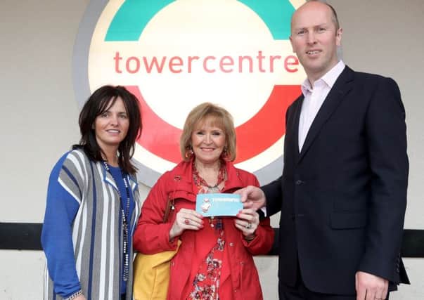 Irene receiving her prize from Roger Craig, Tower Centre and Alison Moore, Ballymena Business Improvement District (BID) Manager. Picture: McIlwaine Media