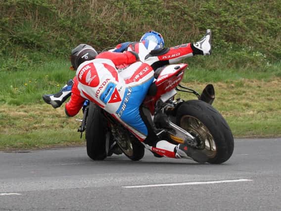 Honda Racing's Guy Martin crashed out of the first Superbike race at the Tandragee 100 after tangling with Paul Jordan at Marlacoo corner.