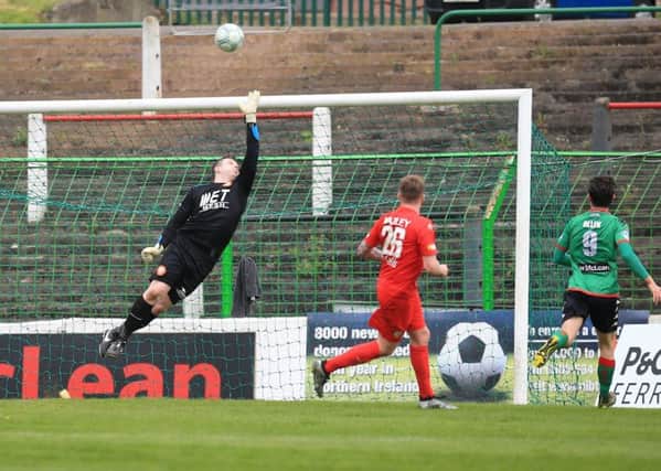 Jack Duffin at a stretch but unable to keep out Eric Foley's free-kick delivery for Glentoran against Portadown. Pic by Pacemaker.