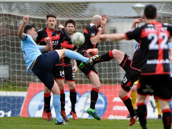 Ballymena United have an sffort on the Crusaders goal