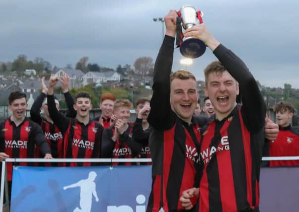 Banbridge Town Reserves captain Sean Montgomery (left) and vice-captain Brian Johnston (right) lift the NIFL Championship Development League South trophy at Crystal Park. Pic: David Hunter/NI Football League