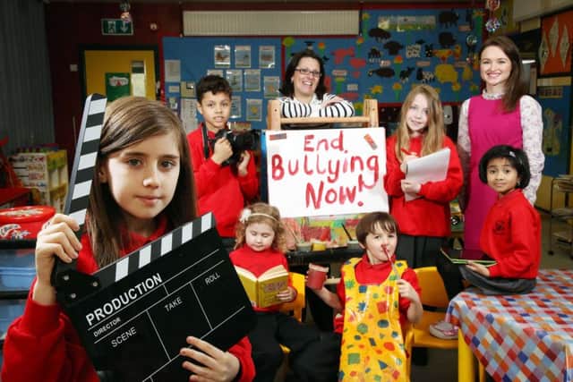 Astrid Conville, Communications Officer, Translink (Anti-Bullying Weeks sponsor) and (r) Rosanna Jack, Regional Co-ordinator, Northern Ireland Anti-Bullying Forum (NIABF) are pictured with pupils  from St Annes Primary School, Dunmurry.