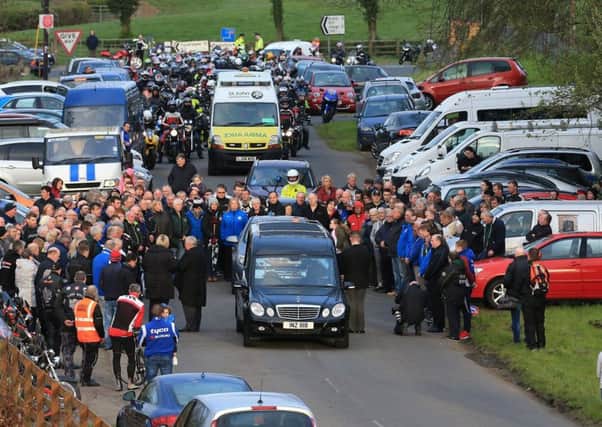 Italian road racer Dario Cecconi's remains were escorted around the Tandragee 100 circuit by motorcyclists and fans during a tribute lap on Thursday night.