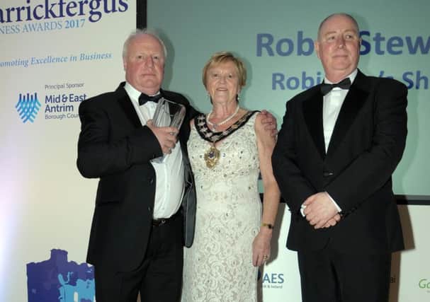 Robin Stewart is awarded the Lifetime Achievement Award from Mayor, Cllr. Audrey Wales MBE and Dessie Blackadder,Multi Media Content Manager, Carrick Times, Robin is Managing Director of Robinson's Shoes in Carrickfergus. INCT 18-221-AM