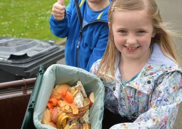 Julia Pearson (7) demonstrates how to recycle food waste in Mid and East Antrim Borough. Photo by Aaron McCracken/Harrisons.