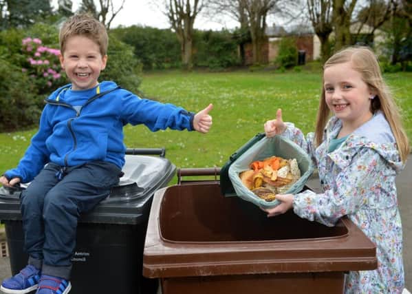 Food for thought!  Oscar Millar (4) gives the thumbs-up as Julia Pearson (7) demonstrates how to recycle - rather than 'bin' - food waste in Mid and East Antrim Borough. 
Photo by Aaron McCracken/Harrisons