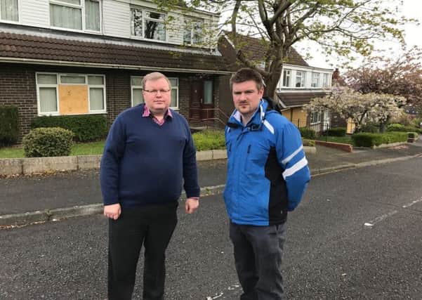 DUP Councillors Jonathan Craig (left) and Scott Carson outside the former MoD houses at Mountview.