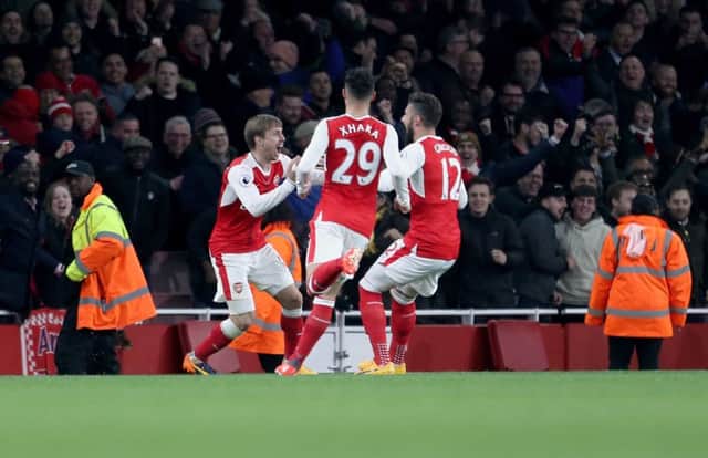 Arsenal's Nacho Monreal (left) celebrate's Leicester's Robert Huth (not pictured) scoring an own goal with team mates during the Premier League match at the Emirates Stadiuml. Photo: Steven Paston/PA Wire.