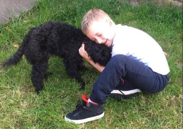Six-year-old Dean is delighted to have Jax back after the family dog went missing for 14 days.