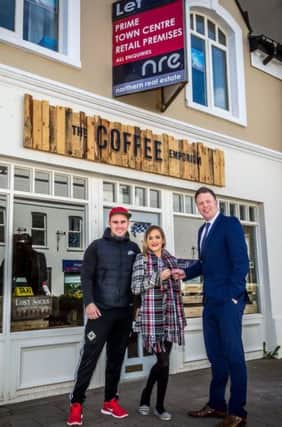 Colin McAleese, Agency manager of NRE,  handing over the keys  to the Coffee Emporium, a new start up by Ella McCloskey and her partner Mark Foster. INCR 19-798-CON