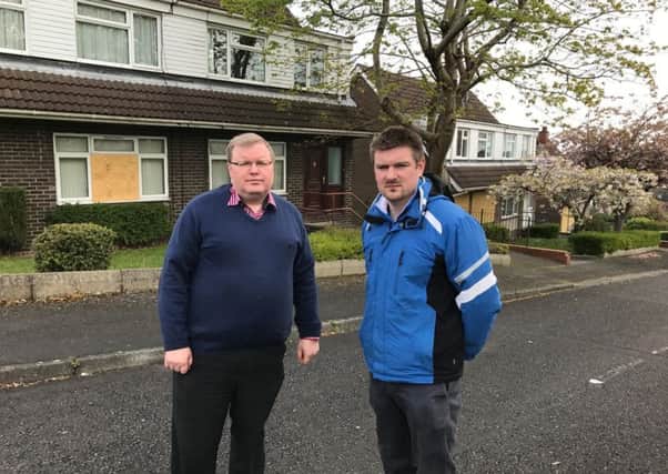 DUP Councillors Jonathan Craig (left) and Scott Carson outside the former MoD houses at Mountview.