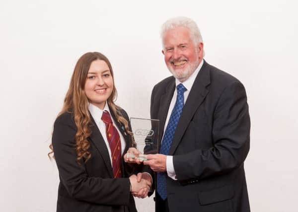 Trevor Carson, CCEA Chairman, presents Amy Barnes from Downshire
School, Carrickfergus, with her Top Candidate award in GCSE Contemporary Crafts.