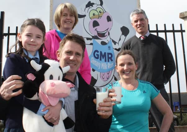 Randal McAlister, dairy farmer and parent; P4 pupil Connie McAlister; Olwyn McCambridge and Marieanne Forester, Heath & Wellbeing Team; and school principal Danny Mulholland promoting the inaugural Glenavy Milk Run.