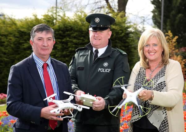 LCCC Chairman of Environmental Services Committee, Cllr James Baird, PSNI Constable Ricky Taylor and Director of Environmental Services, Heather Moore raise awareness of the use of drones on Council property.
