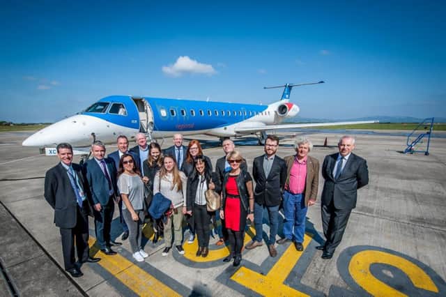 Ciaran Doherty, Tourism Ireland (back row, fourth right); Ian Woodley, BMI Regional (back row fourth left); Roy Devine, City of Derry Airport (back row third left) and Odhran Dunne, Visit Derry (back row second left), with GB journalists who arrived at the City of Derry airport on the inaugural BMI Regional London Stansted flight. Pic by Stephen Latimer