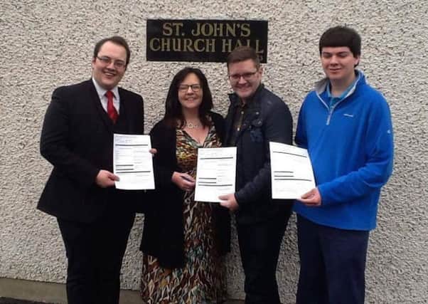 Cllr Alexander Redpath (left) with Stephanie McVicker, Scott Garfield and Ross McClernon at the voter registration clinic held in Stoneyford.