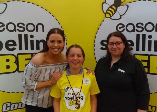Lois is Antrim Spelling Bee Champion Pictured with Cool FMs Rebecca McKinney and Susan Kelly, trainee manager, Eason Donegall Place, Belfast is Lois Angell a P7 pupil from Groggan Primary School, winner of the Antrim "County Bee" heat of the Eason Spelling Bee which was held in Templepatrick Primary School