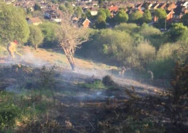 Firefighters dealing with the fire at Cave Hill Country Park.