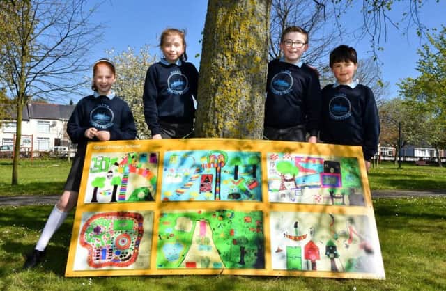 Glynn Primary School pupils and their artwork display. INLT 20-791-CON