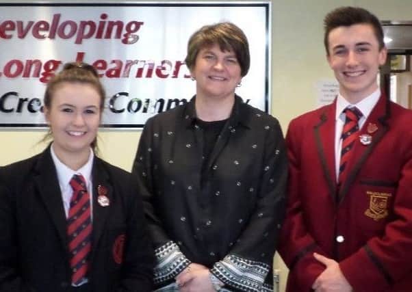 DUP leader, Arlene Foster MLA pictured with Head Boy, Jack Lewis and Head Girl, Katie Shearer at Ballyclare High School.