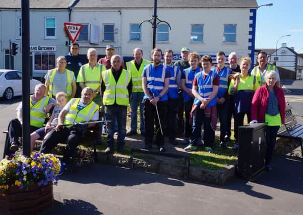 The Ahoghill 'In Bloom' team who put outa call for assistance to the local community for a major spring 'tidy up' and were delighted to receive international support in the form of Thora O'Grady who was  on holiday in the village.