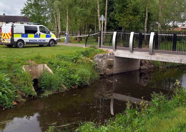 The scene at the Corcrain River in Portadown People's Park where a search is under way for Troubles related weapons and explosives. INPT20-208.