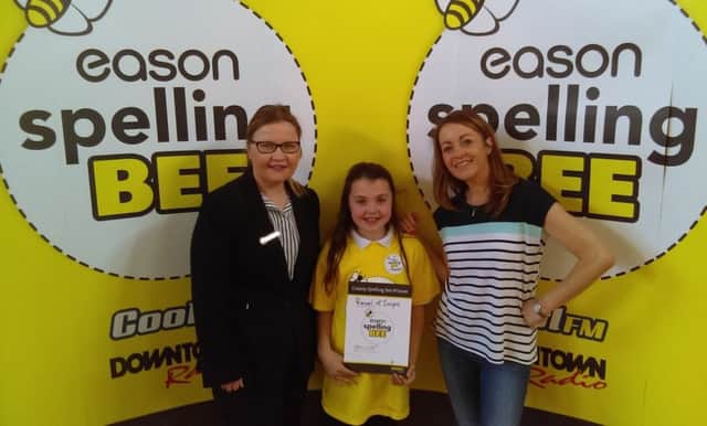 Pictured with Downtown Radios Kirstie McMurray and Kathy Thompson, Manager, Eason Coleraine is Rachel McIntyre a P7 pupil from Termoncanice Primary School, winner of the Derry / Londonderry "County Bee" heat of the Eason Spelling Bee which was held in Termoncanice Primary School in Limavady.