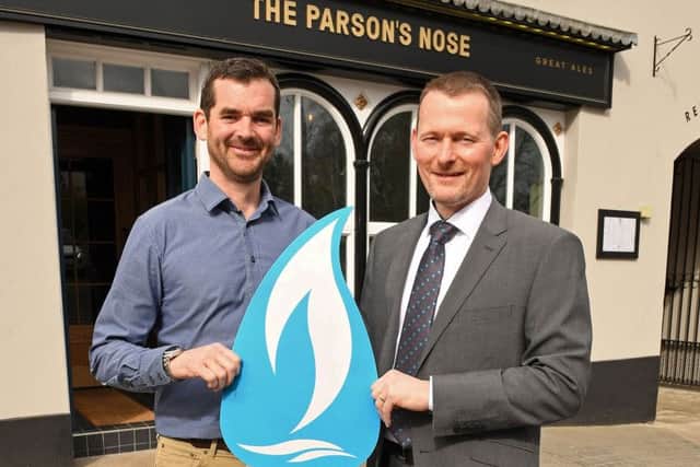 Ronan Sweeney, Managing Director of Balloo Inns and owner of the Parsons Nose is congratulated by Oliver Mars, Industrial and Commercial Sales Manager at Phoenix Natural Gas, on being the first business to connect to the natural gas network as part of a major expansion project by the company to extend the pipeline to 13 towns across County Down. For more information on the benefits of natural gas visit www.phoenixnaturalgas.com.