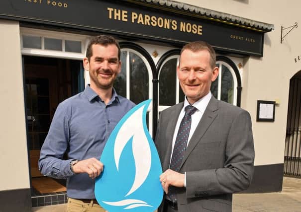 Ronan Sweeney, Managing Director of Balloo Inns and owner of the Parsons Nose is congratulated by Oliver Mars, Industrial and Commercial Sales Manager at Phoenix Natural Gas, on being the first business to connect to the natural gas network as part of a major expansion project by the company to extend the pipeline to 13 towns across County Down. For more information on the benefits of natural gas visit www.phoenixnaturalgas.com.
