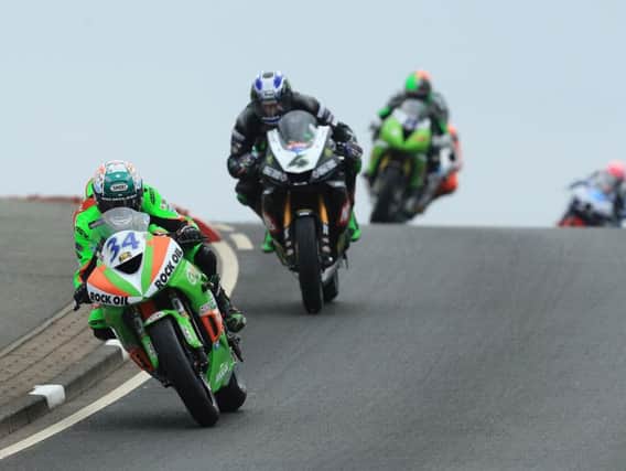 Alastair Seeley leads Ian Hutchinson and Martin Jessopp in the Supersport race.