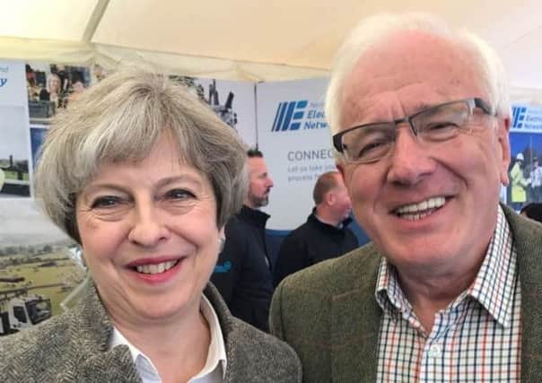 Prime Minister Theresa May poses for a picture with Alderman Allan Ewart.