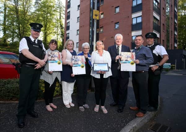 Redwoods residents and Neighbourhood Watch coordinators Trudy Smith and Margaret Wright with Constable Joel McClurghan, PCSP Chairman Alderman Michael Henderson MBE, Philip Whyte from Clanmil Housing and Constable Peter McAllister.