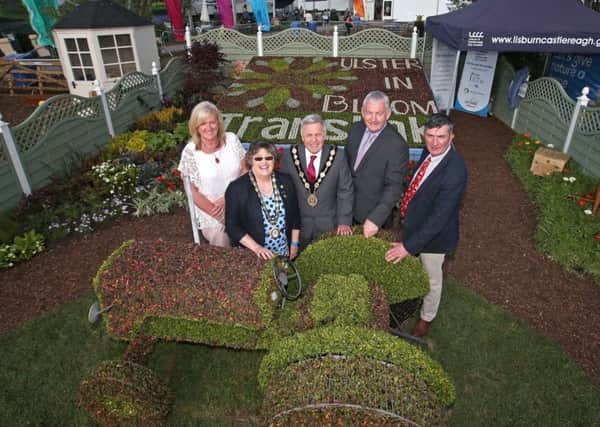 Pictured with 'The Tractor' floral display at the council stand in 'Healthy Horticulture' at Balmoral Show are: (l-r) Heather Moore, Director of Environmental Services; Mayoress Rosalind Bloomfield; Mayor Brian Bloomfield MBE; Councillor Sean McPeake, NILGA President and Councillor James Baird, Chairman of the council's Environmental Services Committee.