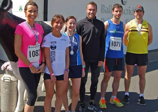 Milking the applause: The 10k winners pose for a picture. Photos by Bert Trowlen