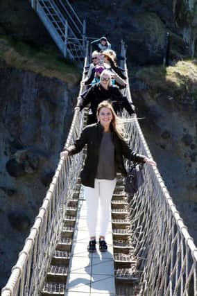 Pictured crossing Carrick-a-Rede rope bridge is Martha Behan, Tourism Ireland Australia leading the Australian and New Zealand travel agents across the bridge.
