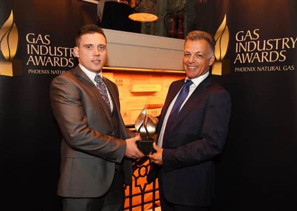 Michael McKinstry, Chief Executive Officer of Phoenix Natural Gas, presents Lisburn based installer, Thomas Hynes, with a prestigious achievement award at the annual Northern Ireland Gas Industry Awards, held recently at The Plough Inn, Hillsborough.