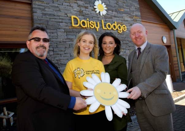(l-r) Paul Heaney from Mercury Security Management, Lauren Cunningham from Cancer Fund for Children and Amy Dickson and Francis Cullen also of Mercury Security Management announce partnership at Cancer Fund for Childrens short break facility, Daisy Lodge.